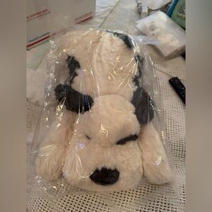 Weighted stuffed dog nib